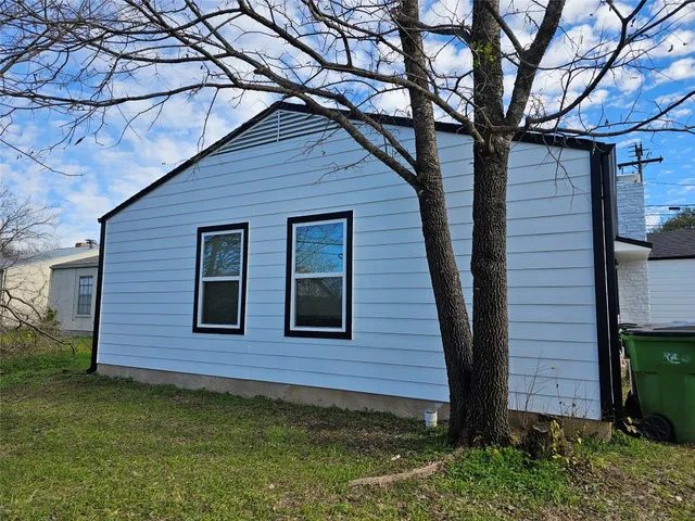 a brick house with a large window