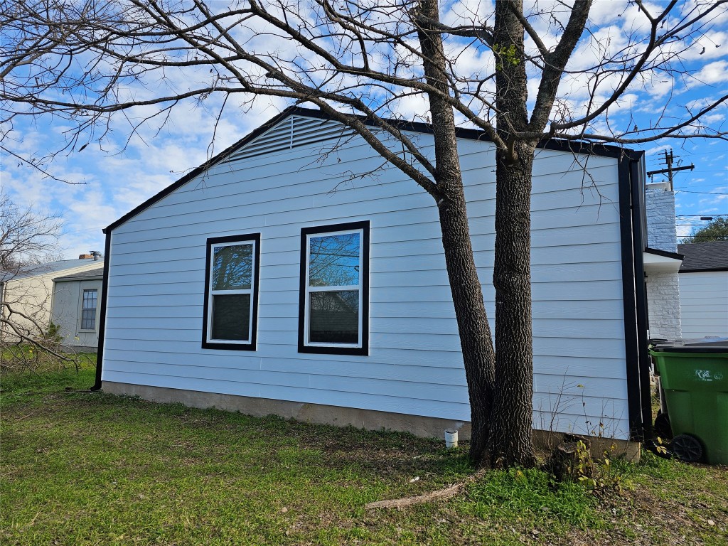 1008 Cushing Drive, Unit B Round Rock, TX 78664 - Photo 8 of 9 View of side of property with a yard