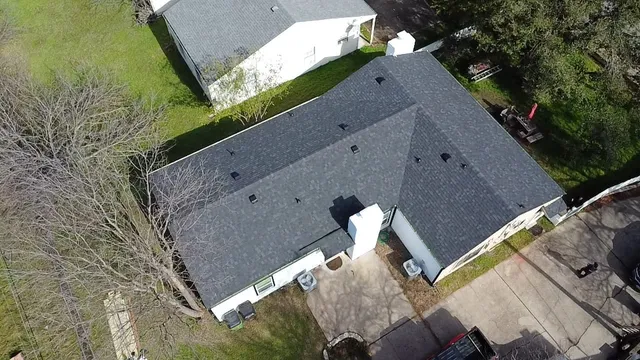 an aerial view of a house with outdoor space