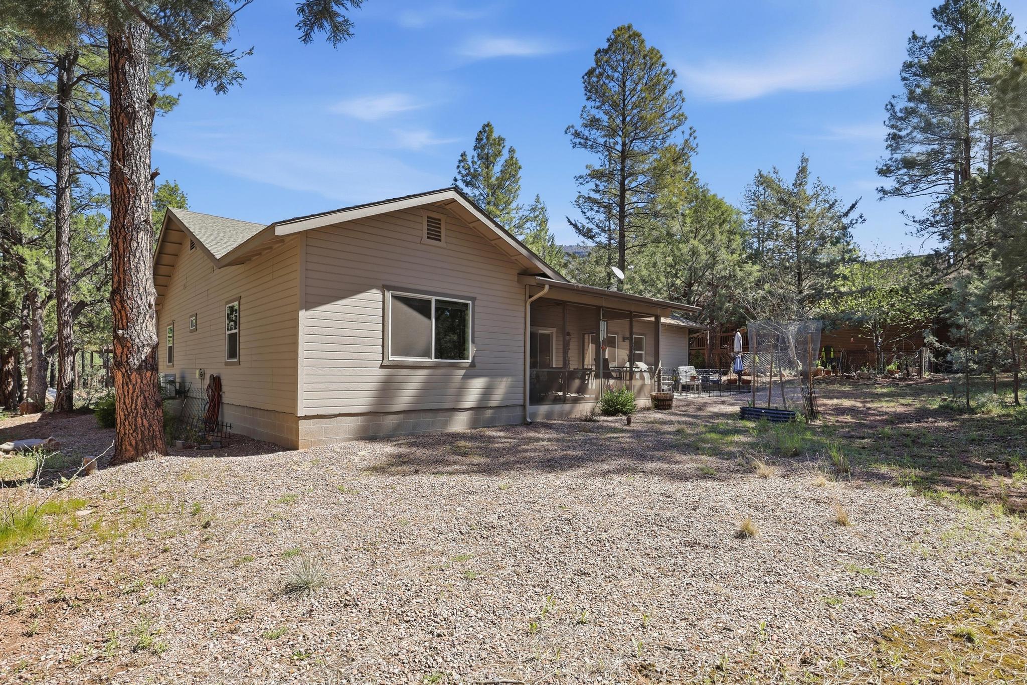 5501 Solitude Trail Loop Pine, AZ 85544 - Photo 26 of 27 a view of a house with a yard