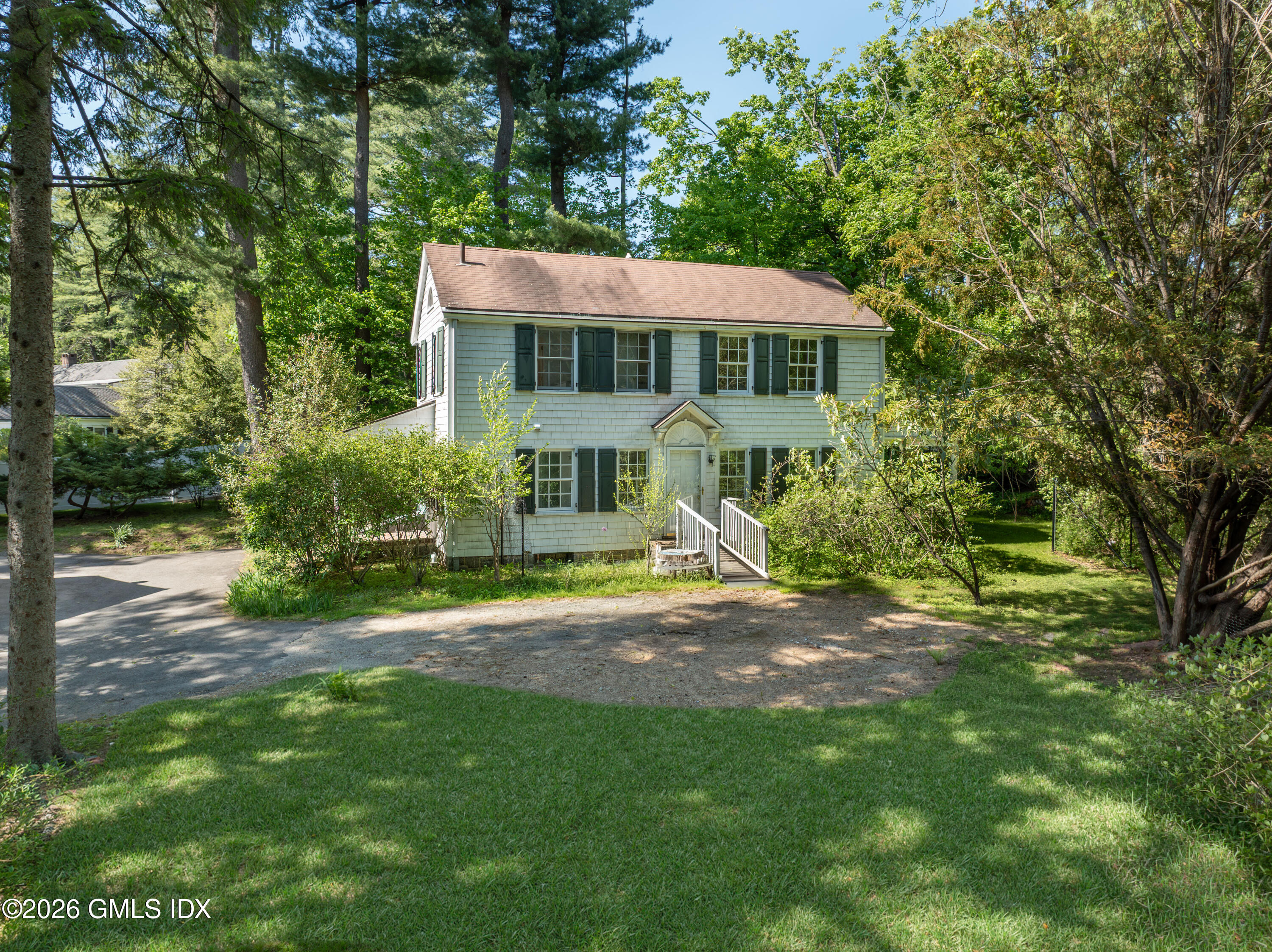 122 Round Hill Road Greenwich, CT 06831 - Photo 27 of 37 a view of a house with a yard