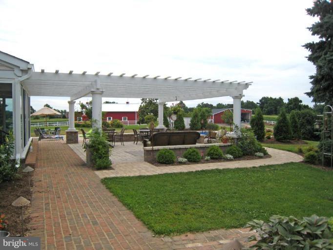 5329 Brooks Woods Road Lothian, MD 20711 - Photo 6 of 30 Napa Valley-inspired patio with pergola