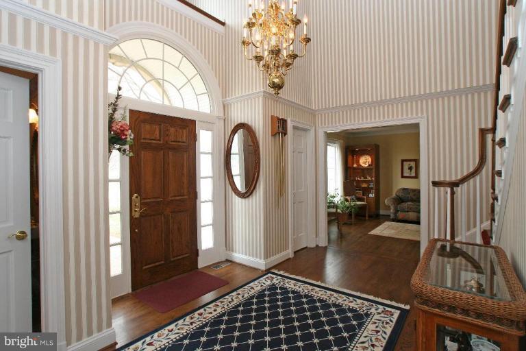 5329 Brooks Woods Road Lothian, MD 20711 - Photo 7 of 30 Elegant 2 story foyer with hardwood floors