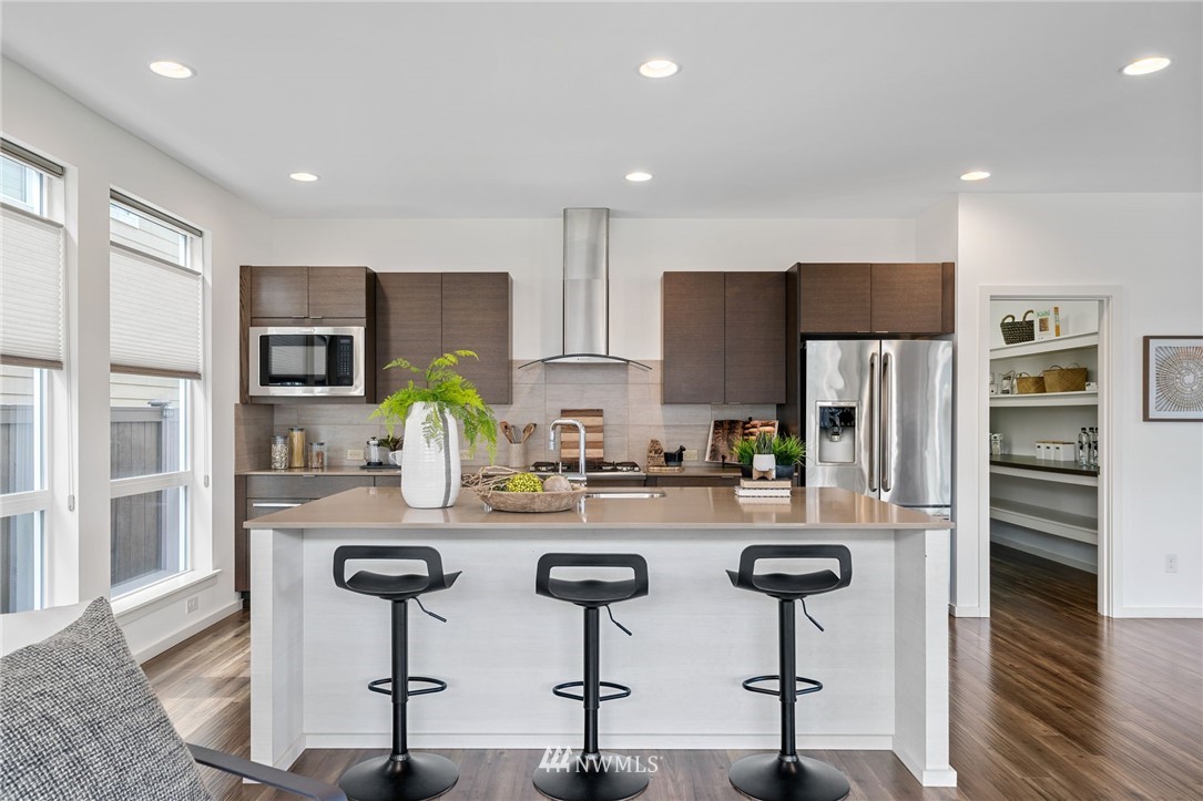 17223 40th Avenue Southeast Bothell, WA 98012 - Photo 13 of 37 a kitchen with stainless steel appliances granite countertop a refrigerator and microwave