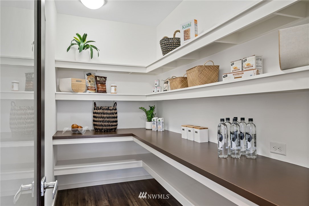 17223 40th Avenue Southeast Bothell, WA 98012 - Photo 16 of 37 a hallway with a dining table chair with the cabinets