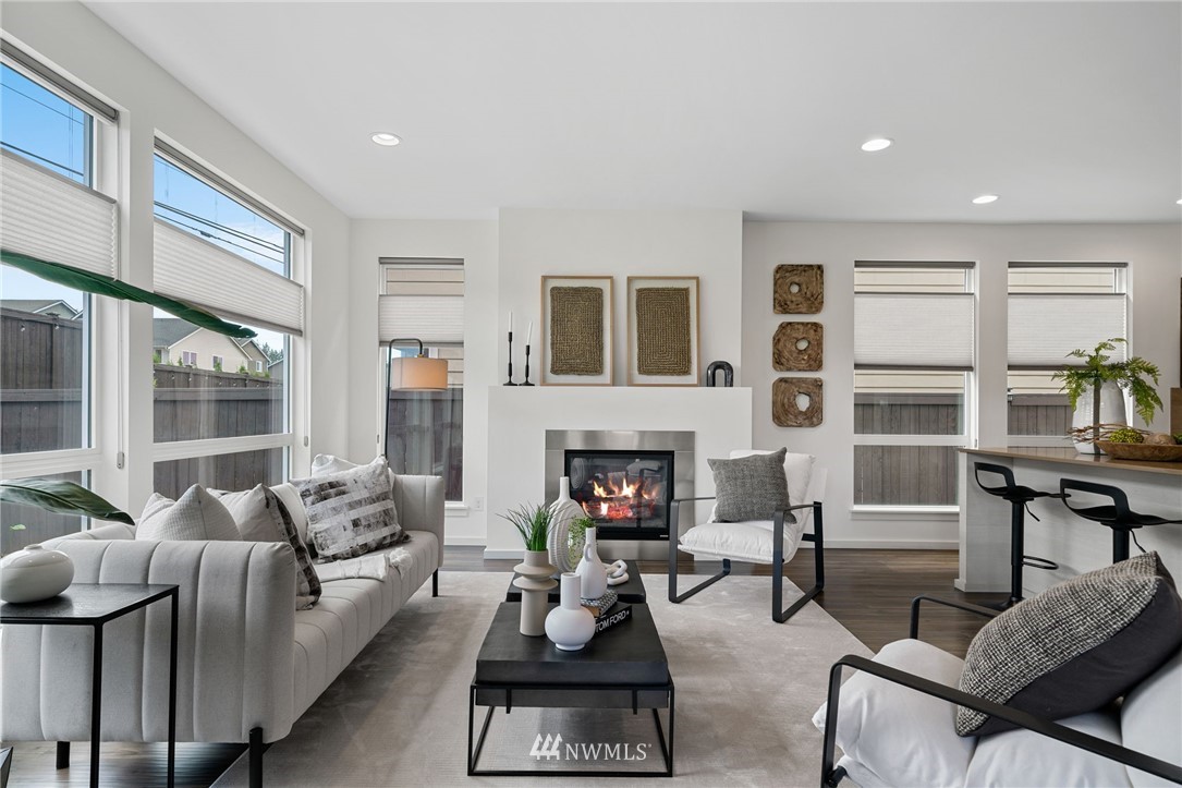 17223 40th Avenue Southeast Bothell, WA 98012 - Photo 19 of 37 a living room with furniture fireplace and flat screen tv