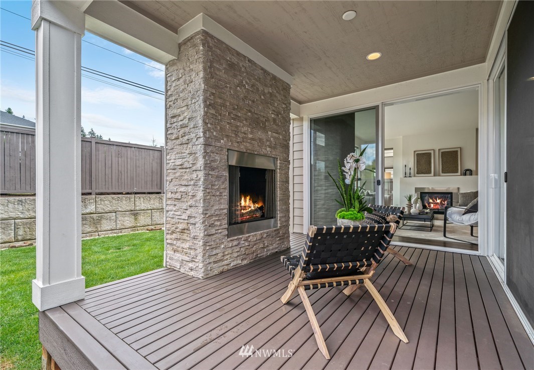 17223 40th Avenue Southeast Bothell, WA 98012 - Photo 21 of 37 a porch with wooden floor outdoor seating and yard