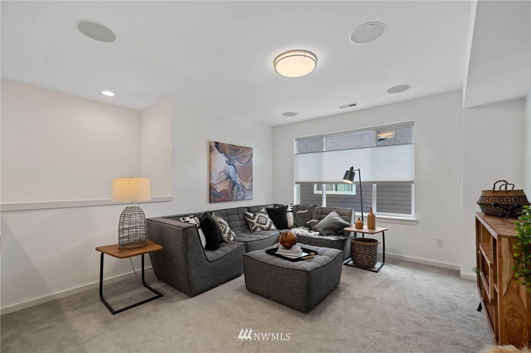 17223 40th Avenue Southeast Bothell, WA 98012 - Photo 22 of 37 a living room with furniture and a lamp