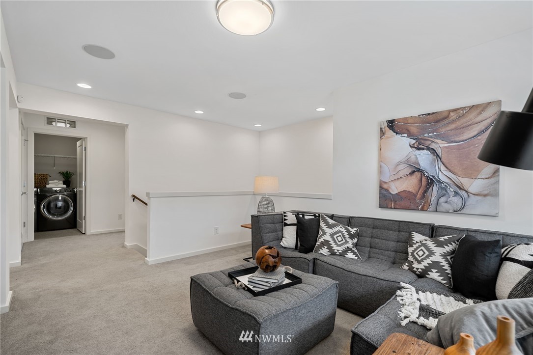 17223 40th Avenue Southeast Bothell, WA 98012 - Photo 23 of 37 a living room with furniture and a wooden floor