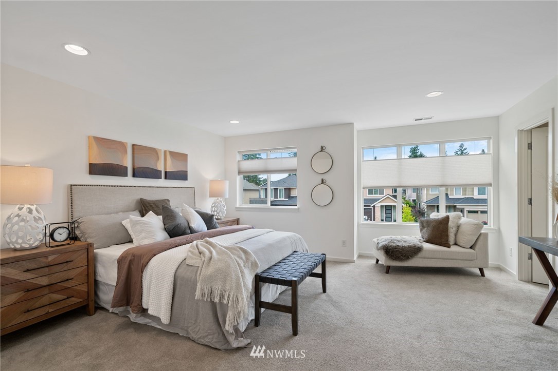 17223 40th Avenue Southeast Bothell, WA 98012 - Photo 25 of 37 a bedroom with a bed couch and a large window