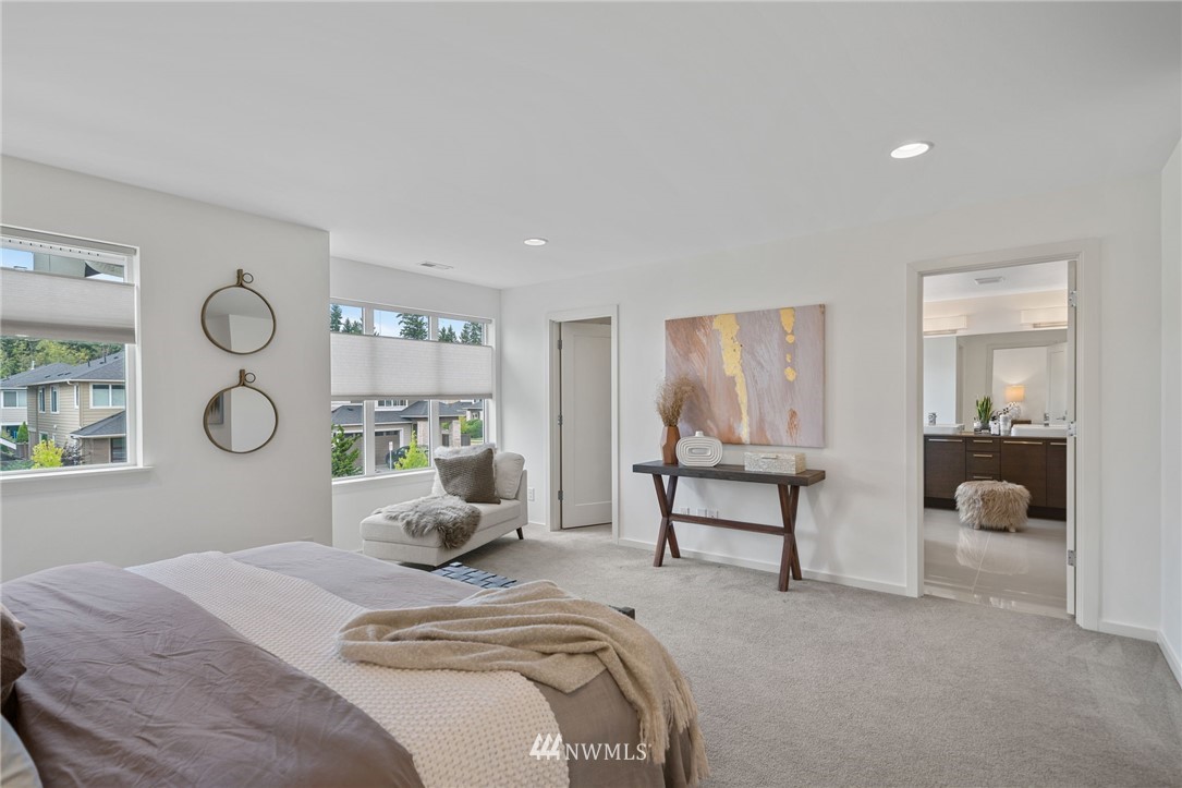 17223 40th Avenue Southeast Bothell, WA 98012 - Photo 26 of 37 a bedroom with a bed and a large window with outer view