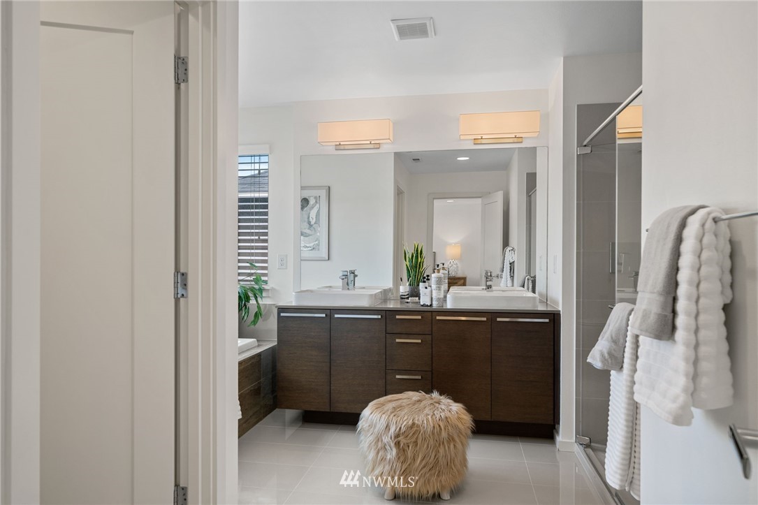 17223 40th Avenue Southeast Bothell, WA 98012 - Photo 28 of 37 a spacious bathroom with a sink and a mirror