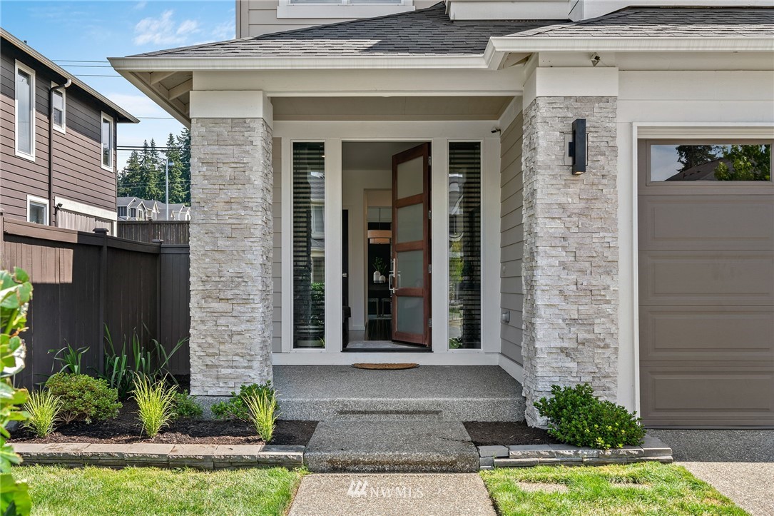 17223 40th Avenue Southeast Bothell, WA 98012 - Photo 4 of 37 a front view of a house with a yard