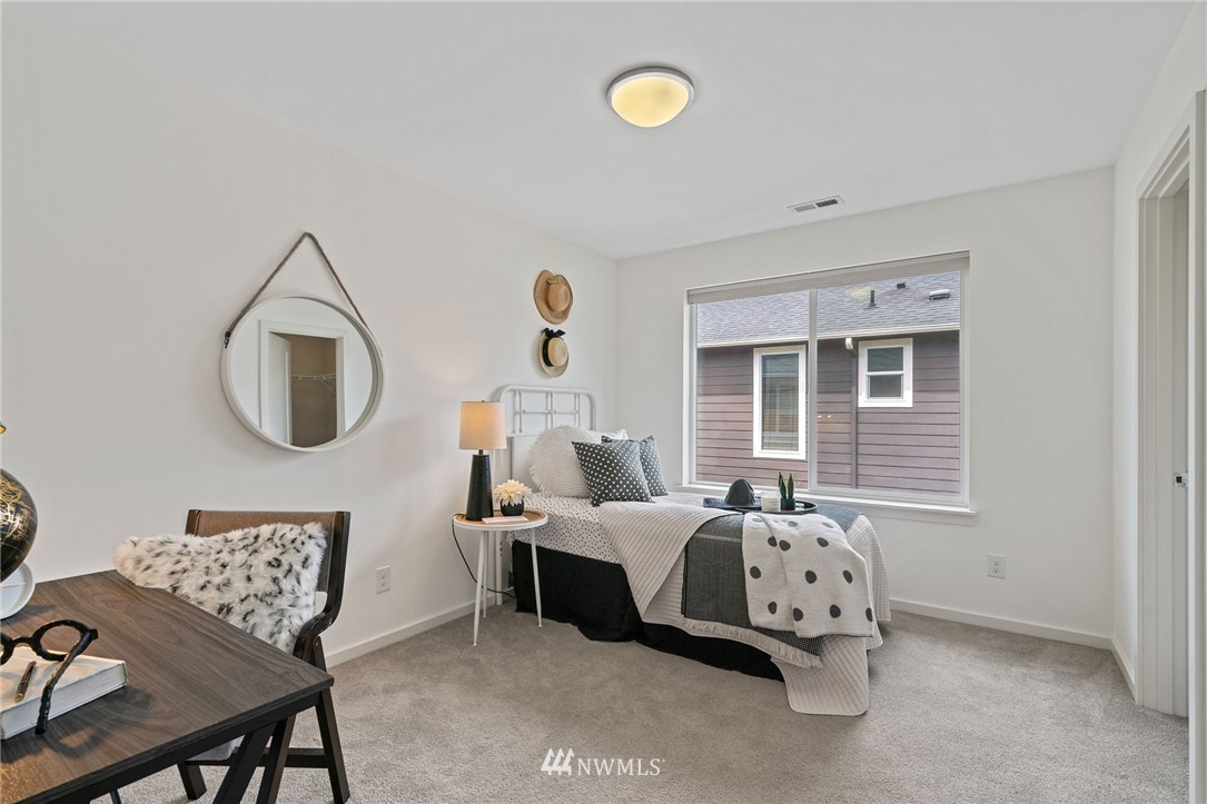 17223 40th Avenue Southeast Bothell, WA 98012 - Photo 32 of 37 a bedroom with bed and a window
