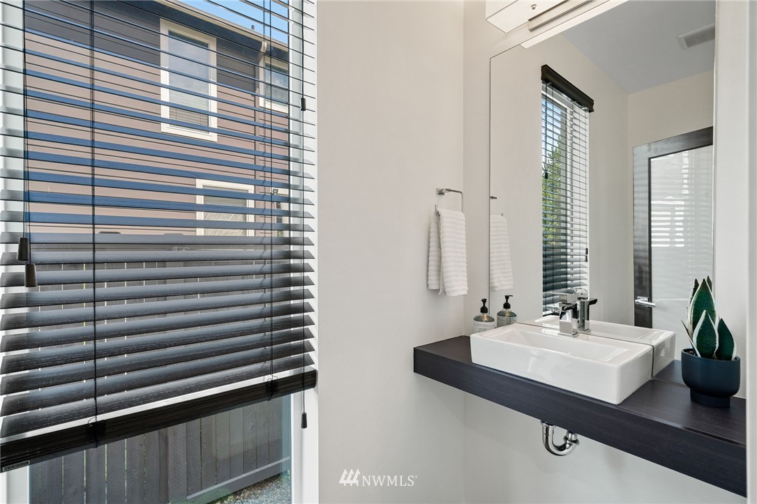 17223 40th Avenue Southeast Bothell, WA 98012 - Photo 7 of 37 a bathroom with a sink and a mirror