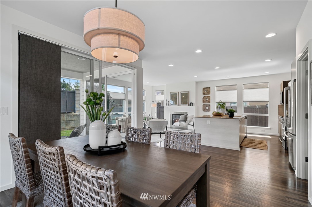 17223 40th Avenue Southeast Bothell, WA 98012 - Photo 10 of 37 a living room with dining table a table and chairs