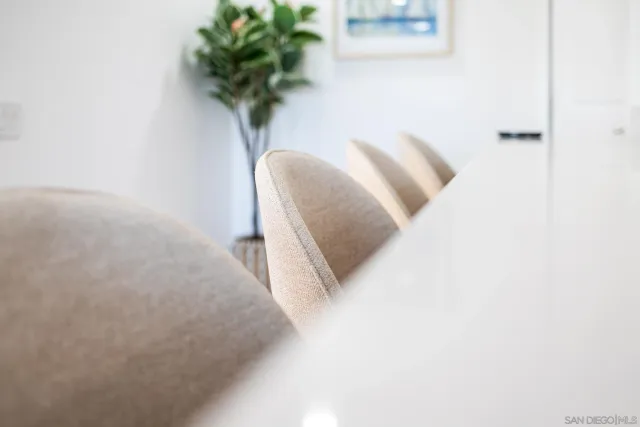 a living room with a fireplace and a table