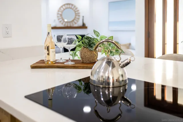 a living room with furniture a fireplace and a large window