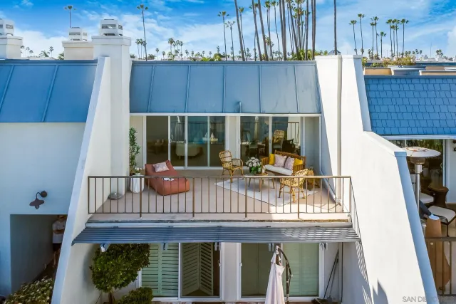 a view of empty room with a fireplace and potted plants