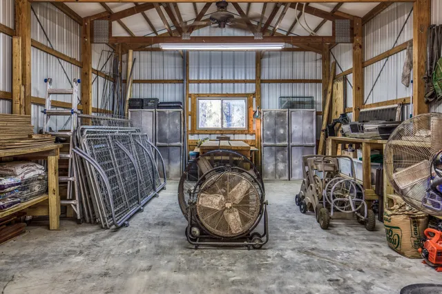 a yard with trees in the background