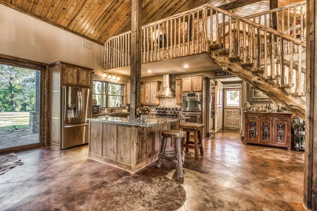 a kitchen with a refrigerator and a sink