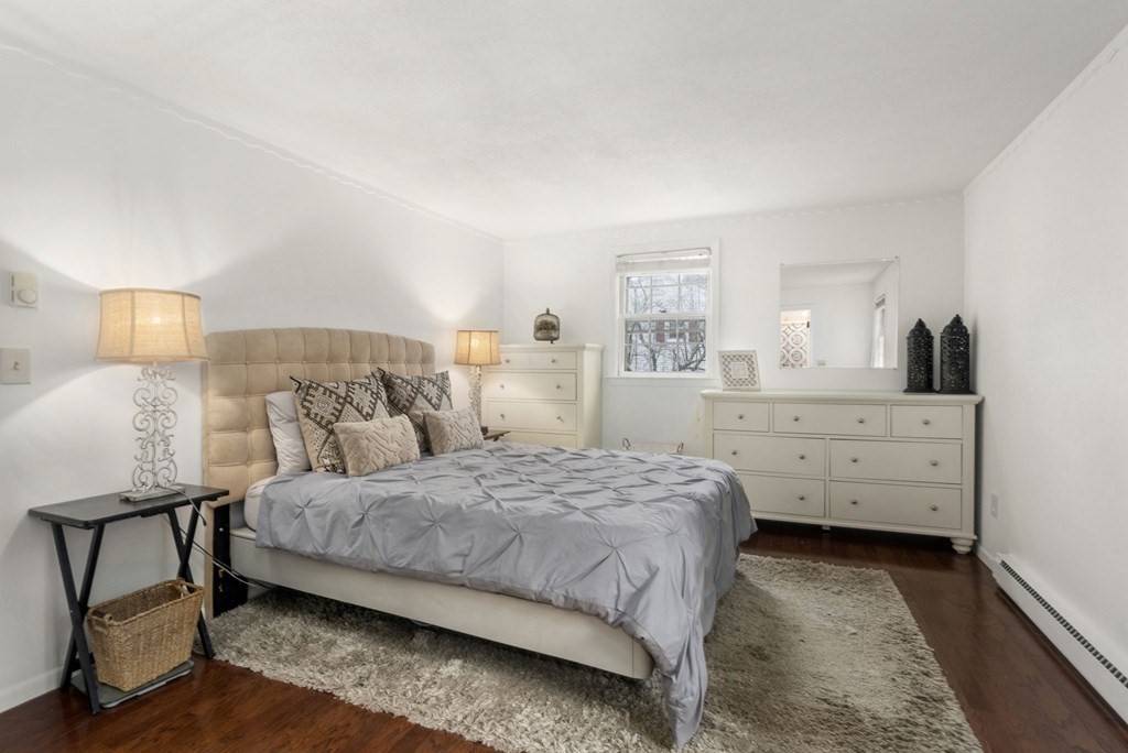 99 Graymore Road Waltham, MA 02451 - Photo 11 of 38 a bedroom with a bed and a cabinets