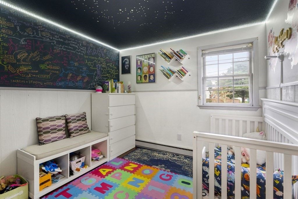 99 Graymore Road Waltham, MA 02451 - Photo 14 of 38 a room with toys and a book shelf