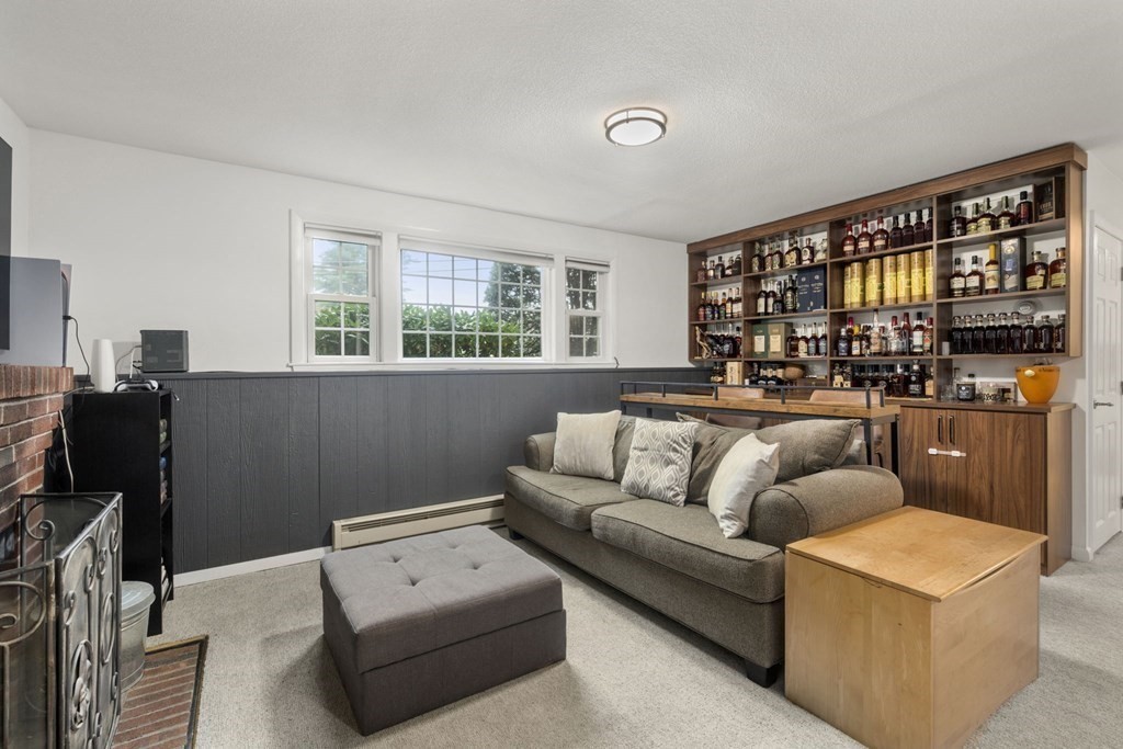 99 Graymore Road Waltham, MA 02451 - Photo 18 of 38 a living room with furniture a ceiling fan and a window