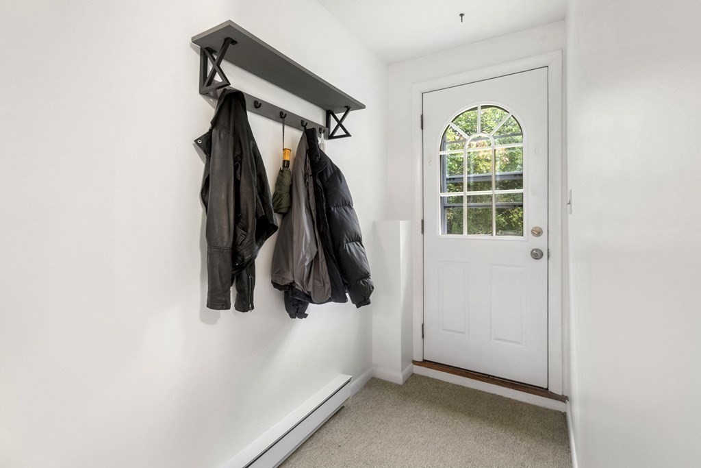 99 Graymore Road Waltham, MA 02451 - Photo 25 of 38 a view of walk in closet with clothes and shoes