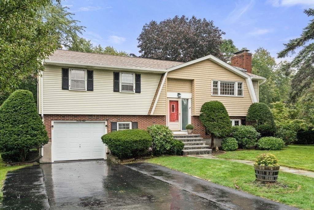 99 Graymore Road Waltham, MA 02451 - Photo 26 of 38 a front view of house with yard and green space
