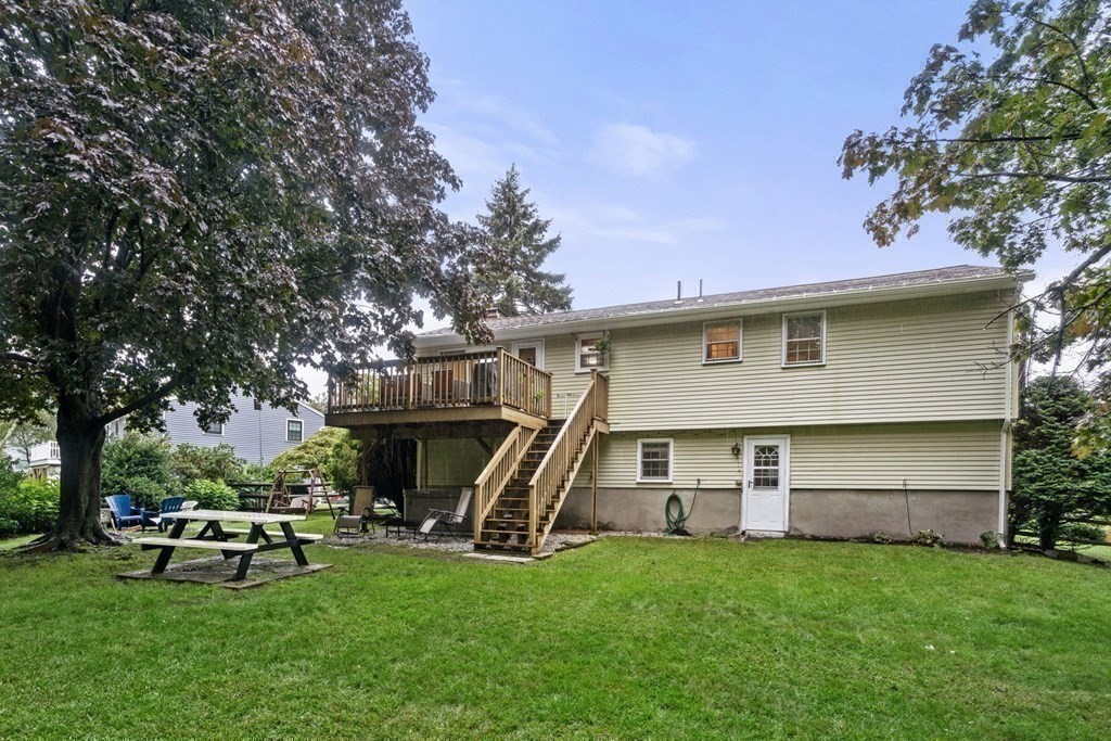 99 Graymore Road Waltham, MA 02451 - Photo 28 of 38 a view of a house with backyard sitting area and garden