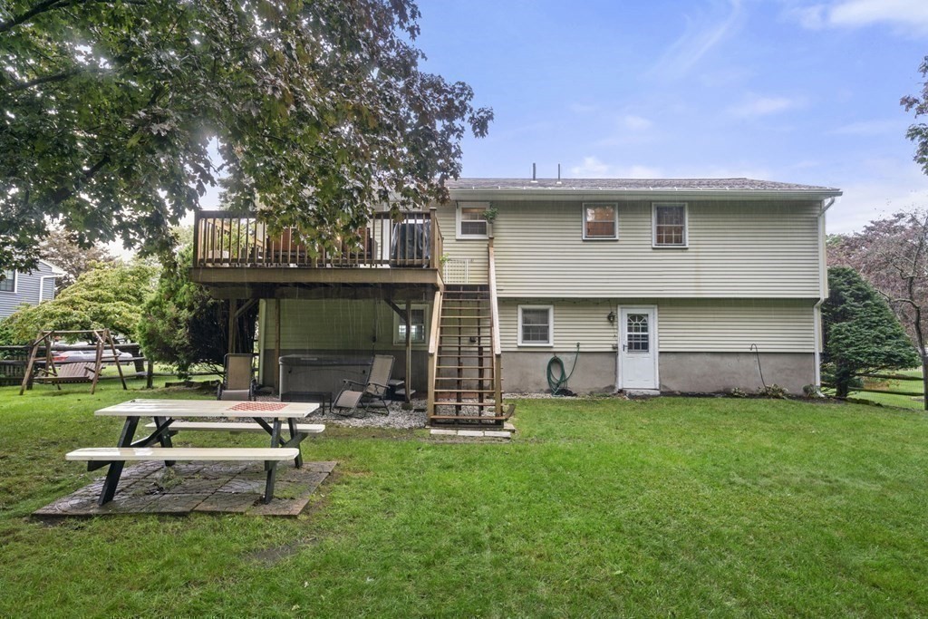 99 Graymore Road Waltham, MA 02451 - Photo 29 of 38 a front view of a house with a garden and trees