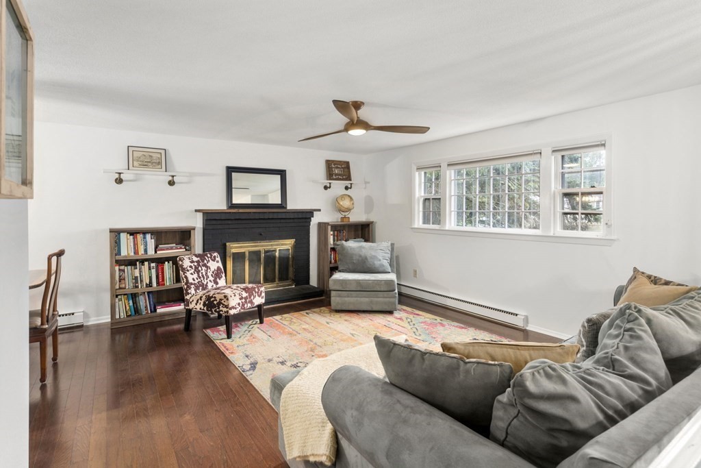 99 Graymore Road Waltham, MA 02451 - Photo 3 of 38 a living room with furniture and a fireplace