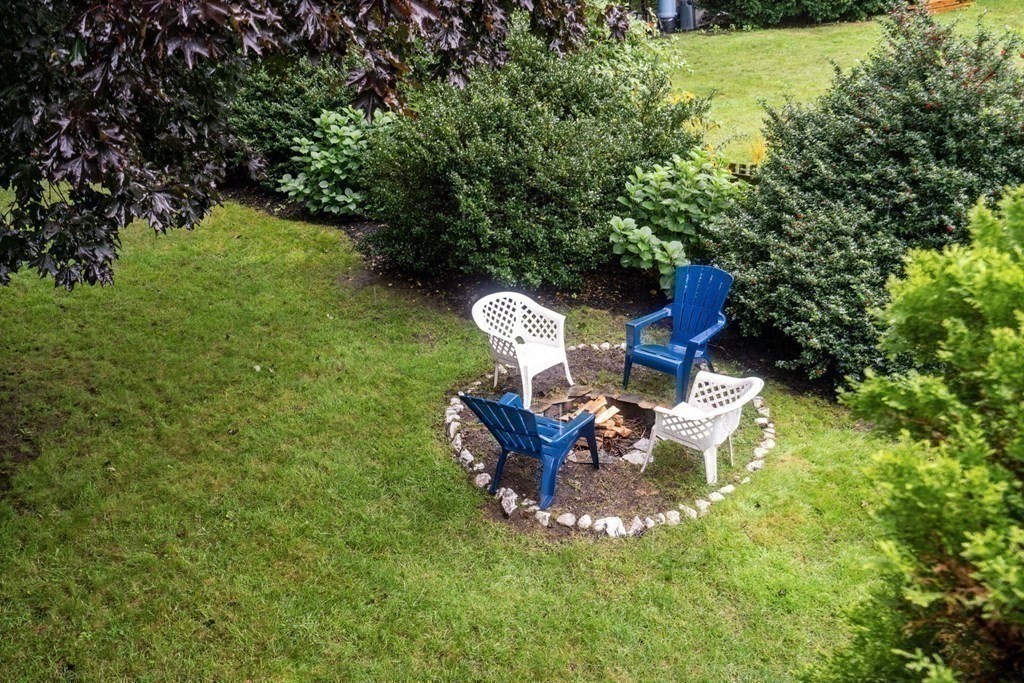 99 Graymore Road Waltham, MA 02451 - Photo 32 of 38 a view of a chair and table in the garden