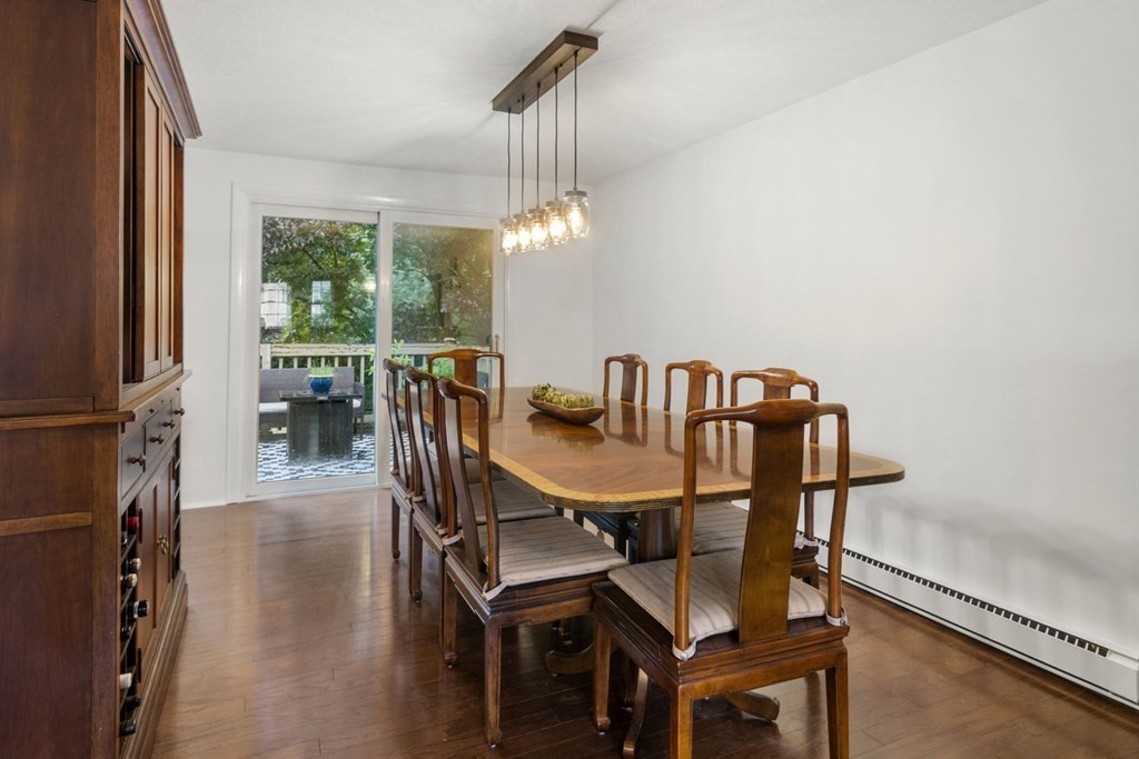 99 Graymore Road Waltham, MA 02451 - Photo 6 of 38 a view of a dining room with furniture window and wooden floor