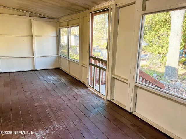 a view of front door with wooden floor
