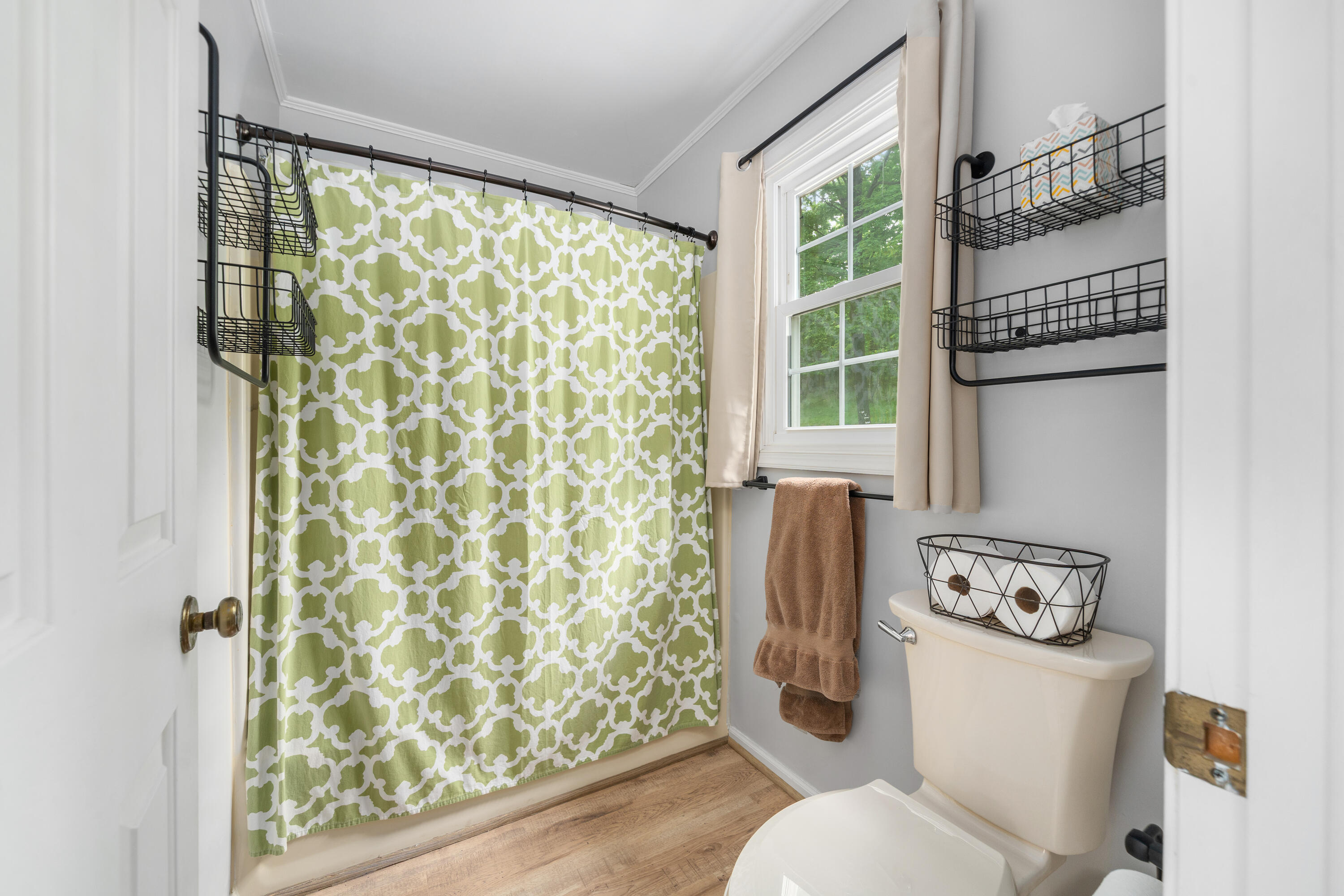 3341 Hidden Oak Road Southwest Roanoke, VA 24018 - Photo 23 of 26 a bathroom with a toilet and a shower curtain