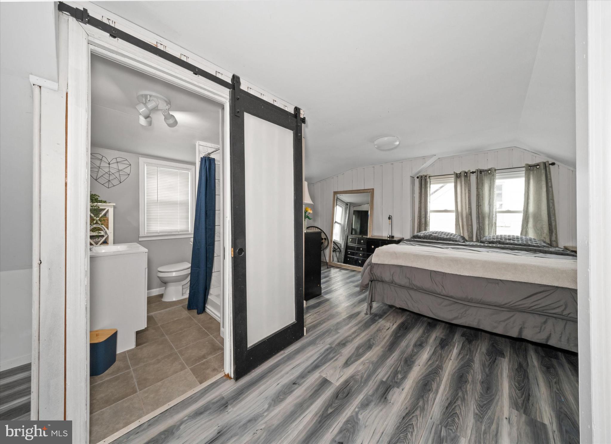 7 2nd Avenue New Castle, DE 19720 - Photo 24 of 44 Charming bedroom with modern bathroom access.