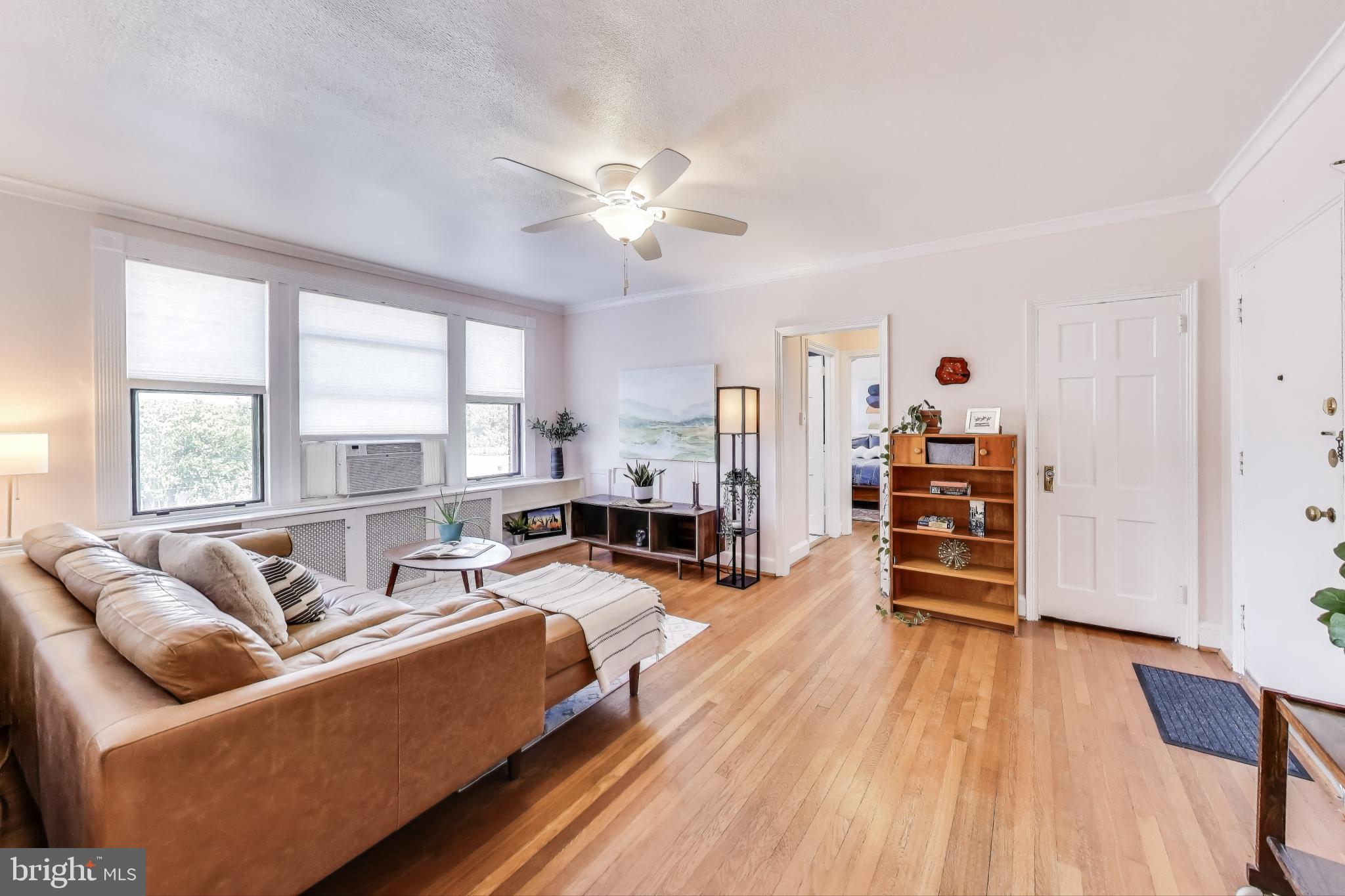 1365 Kennedy Street Northwest, Unit 506 Washington, DC 20011 - Photo 3 of 24 a living room with furniture and a large window