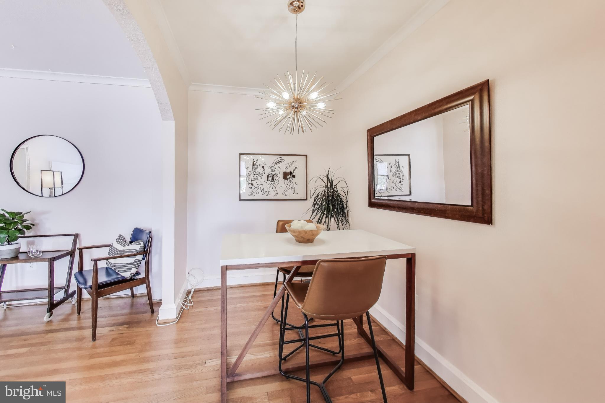 1365 Kennedy Street Northwest, Unit 506 Washington, DC 20011 - Photo 4 of 24 a view of a dining room with furniture and wooden floor