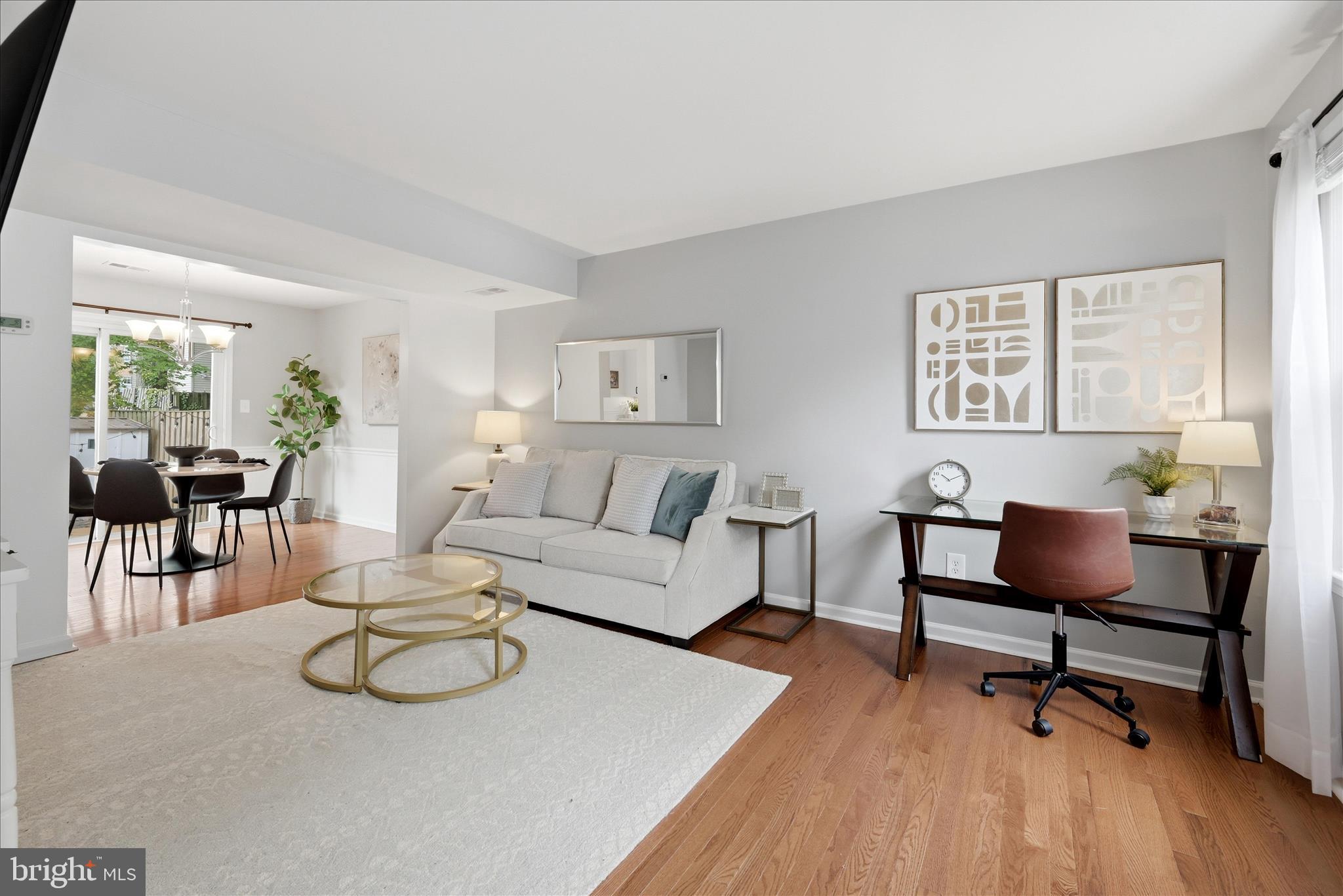 5446 Lighthouse Lane Burke, VA 22015 - Photo 2 of 36 a living room with furniture and a wooden floor