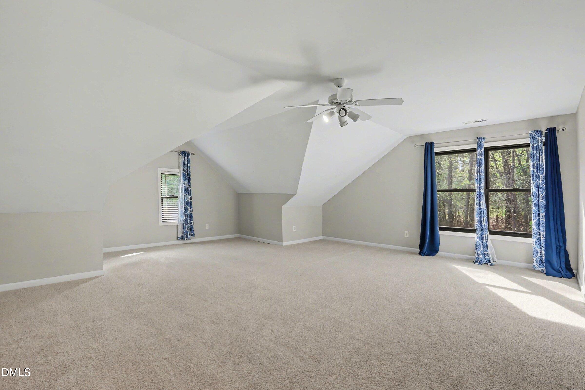 1001 Denfield Court Raleigh, NC 27615 - Photo 20 of 44 a view of a big room with closet and windows