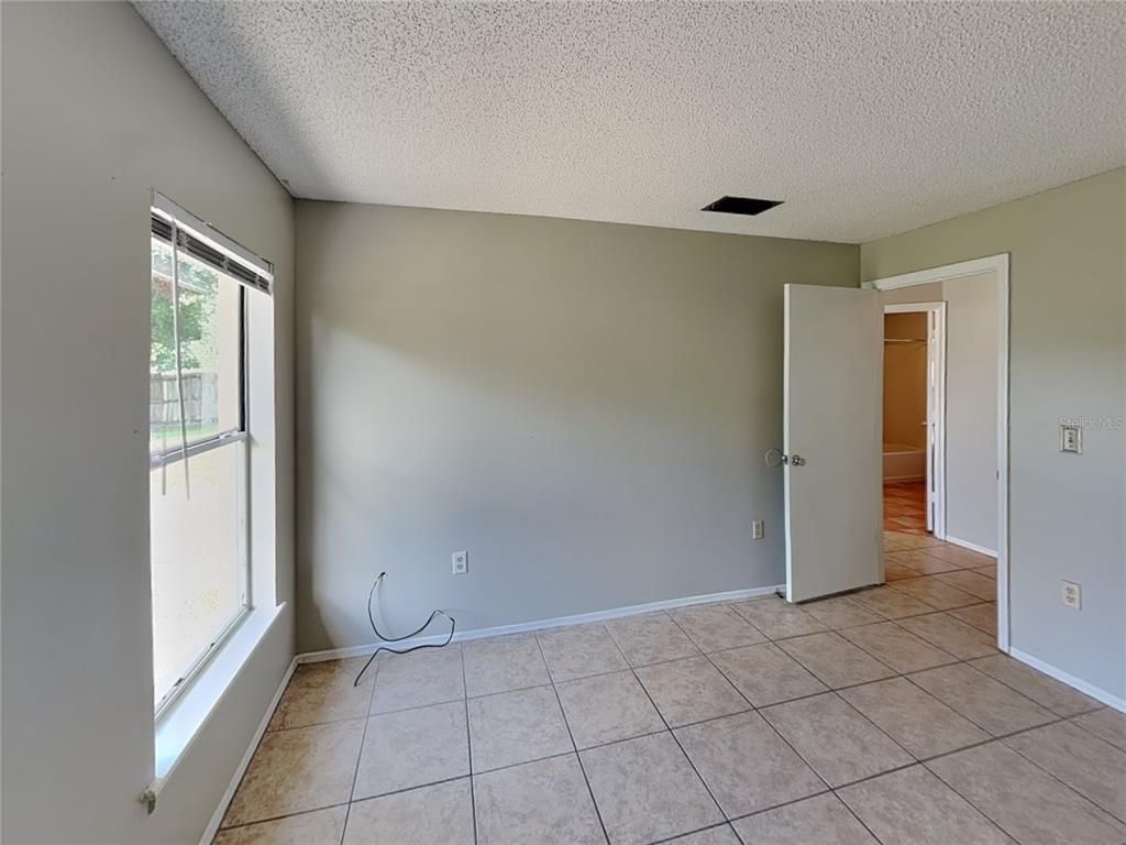 1618 Cassingham Circle Ocoee, FL 34761 - Photo 12 of 15 a view of an empty room and window