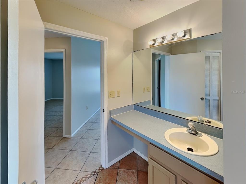 1618 Cassingham Circle Ocoee, FL 34761 - Photo 13 of 15 a bathroom with a sink and a mirror