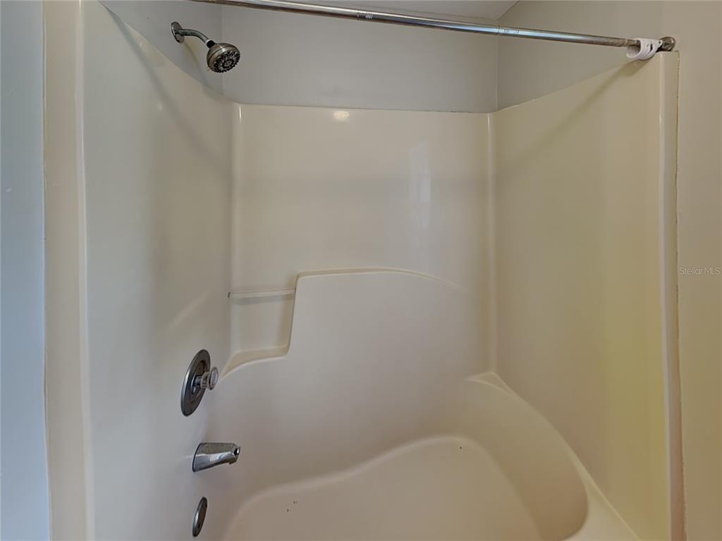 1618 Cassingham Circle Ocoee, FL 34761 - Photo 14 of 15 a bathroom with a shower and a bath tub