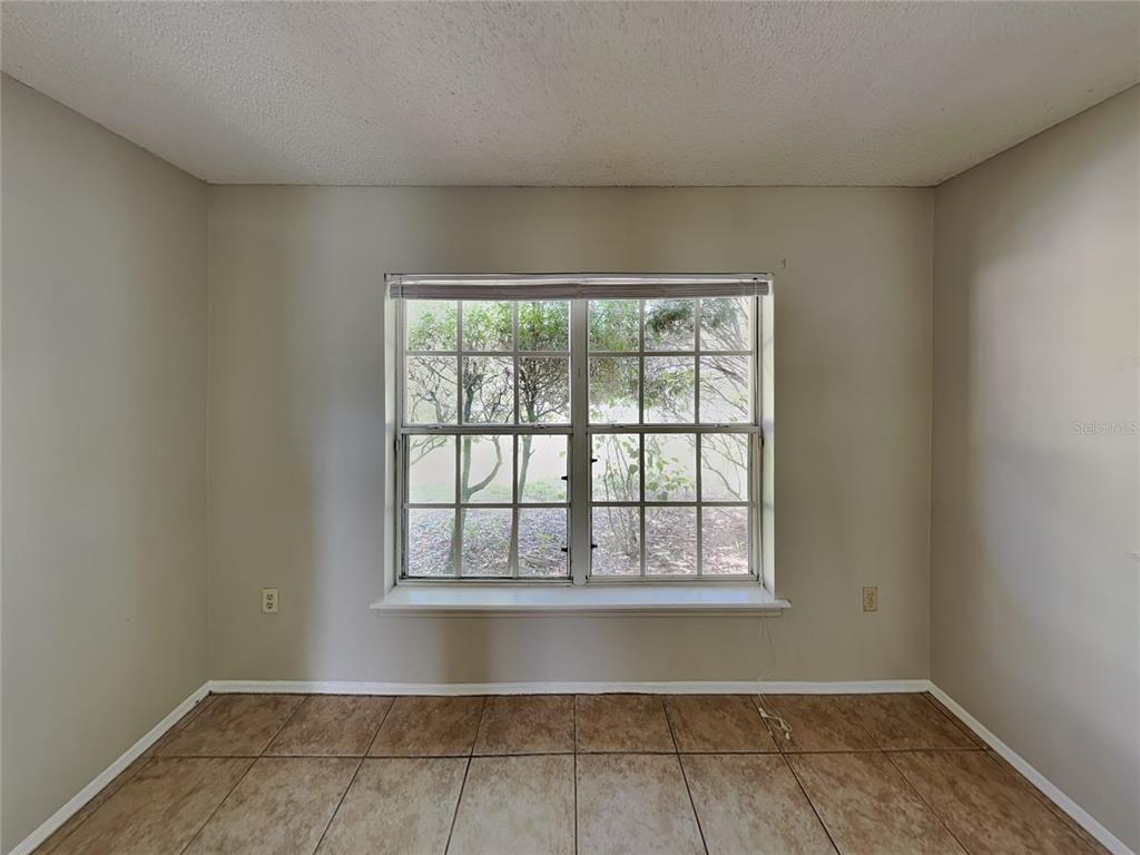 1618 Cassingham Circle Ocoee, FL 34761 - Photo 9 of 15 a view of an empty room with a window