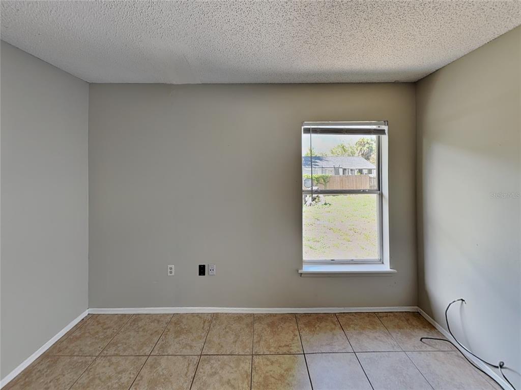 1618 Cassingham Circle Ocoee, FL 34761 - Photo 10 of 15 a view of an empty room with a window