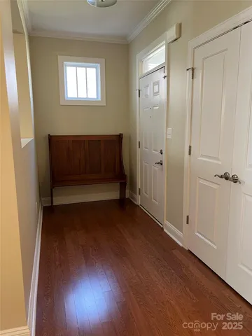 a view of entryway with wooden floor