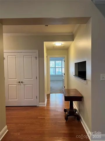 a view of a livingroom with lounge chair and cabinet