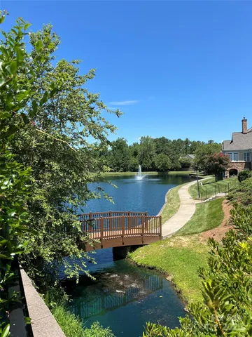 a view of a swimming pool with a yard